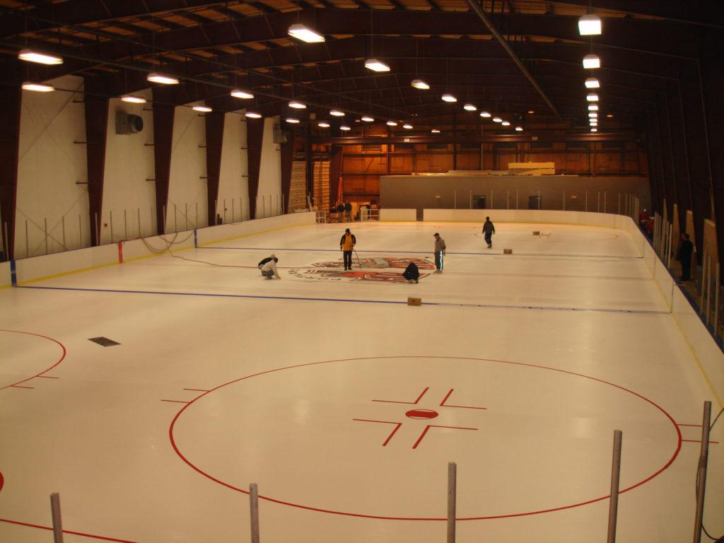 Portland Pirates logo being painted on the ice